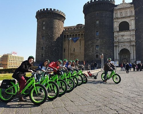 A group of toursits on green ebike's